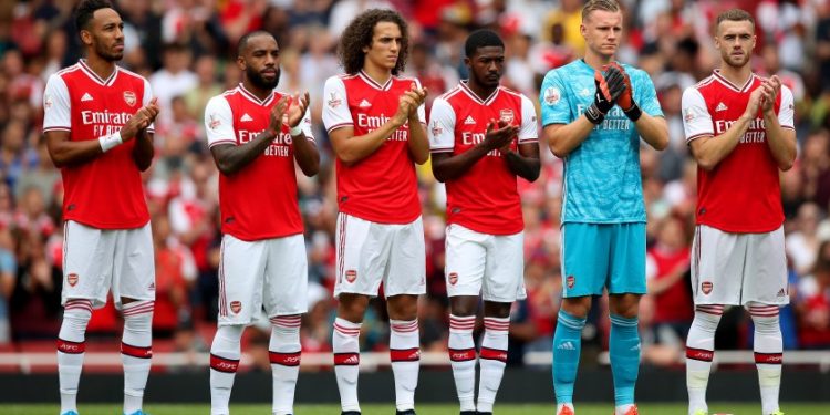 Arsenal's (left to right) Pierre-Emerick Aubameyang, Alexandre Lacazette, Matteo Guendouzi, Ainsley Maitland-Niles, Bernd Leno, Calum Chambers during a minute's applause for former player Jose Antonio Reyes, who died recently, before the Emirates Cup match at the Emirates Stadium, London.