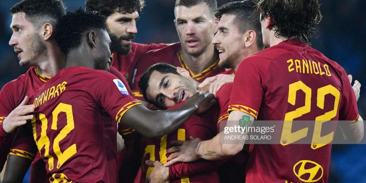AS Roma's Armenian midfielder Henrik Mkhitaryan (C) celebrates with teammates after scoring during the Italian Serie A football match AS Roma vs Spal on December 15, 2019 at the Olympic stadium in Rome. (Photo by Andreas SOLARO / AFP) (Photo by ANDREAS SOLARO/AFP via Getty Images)