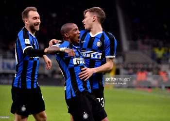 MILAN, ITALY - JANUARY 29:  (L-R) Nicolo Barella of Inter celebrates 2-1 with Ashley Young of Inter, Christian Eriksen of Inter  during the Italian Coppa Italia  match between Internazionale v Fiorentina at the San Siro on January 29, 2020 in Milan Italy (Photo by Mattia Ozbot/Soccrates/Getty Images)