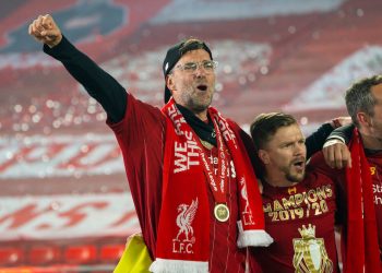 LIVERPOOL, ENGLAND - Wednesday, July 22, 2020: Liverpool’s manager Jürgen Klopp sings "You'll Never Walk Alone" with his staff and players after receiving being crowned Premier League champions after the FA Premier League match between Liverpool FC and Chelsea FC at Anfield. The game was played behind closed doors due to the UK government’s social distancing laws during the Coronavirus COVID-19 Pandemic. Liverpool won 5-3. (Pic by David Rawcliffe/Propaganda)