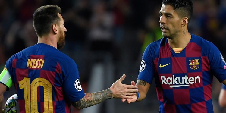 Barcelona's Uruguayan forward Luis Suarez (R) is congratulated by teammate Barcelona's Argentine forward Lionel Messi after scoring a goal during the UEFA Champions League Group F football match between Barcelona and Inter Milan at the Camp Nou stadium in Barcelona, on October 2, 2019. (Photo by LLUIS GENE / AFP) (Photo by LLUIS GENE/AFP via Getty Images)