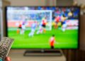 Watching football at home on TV