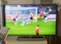 Watching football at home on TV