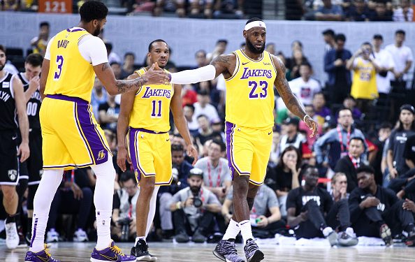 SHENZHEN, CHINA - OCTOBER 12:#23  LeBron James, #3 Anthony Davis and #11 Avery Bradley of the Los Angeles Lakers celebrate during the match against the Brooklyn Nets during a preseason game as part of 2019 NBA Global Games China at Shenzhen Universiade Center on October 12, 2019 in Shenzhen, Guangdong, China. (Photo by Zhong Zhi/Getty Images)
