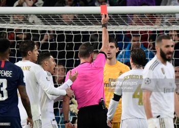 Portuguese referee Artur Dias hands a red card to Real Madrid's Belgian goalkeeper Thibaut Courtois during the UEFA Champions League group A football match against Paris Saint-Germain FC at the Santiago Bernabeu stadium in Madrid on November 26, 2019. (Photo by JAVIER SORIANO / AFP) (Photo by JAVIER SORIANO/AFP via Getty Images)