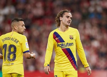 Barcelona's Antoine Griezmann, right, reacts during the Spanish La Liga soccer match between Athletic Bilbao and FC Barcelona at San Mames stadium in Bilbao, northern Spain, Friday, Aug. 16, 2019. (AP Photo/Ion Alcoba Beitia)