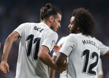 MADRID, SPAIN - AUGUST 19: Gareth Bale of Real Madrid celebrates with Marcelo after scoring his team's second goal during the La Liga match between Real Madrid CF and Getafe CF at Estadio Santiago Bernabeu on August 19, 2018 in Madrid, Spain. (Photo by Denis Doyle/Getty Images)
