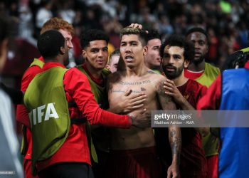 DOHA, QATAR - DECEMBER 21: Roberto Firmino of Liverpool celebrates after scoring a goal to make it 1-0 during the FIFA Club World Cup Qatar 2019 Final match between Liverpool FC and CR Flamengo at Khalifa International Stadium on December 21, 2019 in Doha, Qatar. (Photo by Matthew Ashton - AMA/Getty Images)