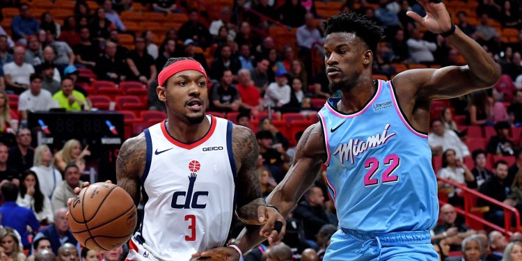 Dec 6, 2019; Miami, FL, USA; Washington Wizards guard Bradley Beal (3) dribbles the ball as Miami Heat forward Jimmy Butler (22) defends the play during the first half at American Airlines Arena. Mandatory Credit: Steve Mitchell-USA TODAY Sports