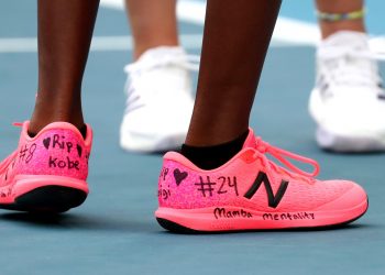 United States' Coco Gauff, front, and compatriot Caty McNally wear a tribute to Kobe Bryant on their shoes during their doubles match against Japan's Shuko Aoyama amd Ena Shibahara at the Australian Open tennis championship in Melbourne, Australia, Monday, Jan. 27, 2020. (AP Photo/Dita Alangkara)