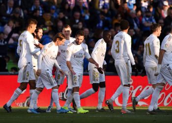 GETAFE, SPAIN - JANUARY 04: Raphael Varane of Real Madrid celebrates with teammates after scoring his team's second goal during the La Liga match between Getafe CF and Real Madrid CF at Coliseum Alfonso Perez on January 04, 2020 in Getafe, Spain. (Photo by Denis Doyle/Getty Images)