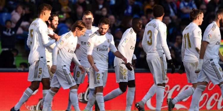 GETAFE, SPAIN - JANUARY 04: Raphael Varane of Real Madrid celebrates with teammates after scoring his team's second goal during the La Liga match between Getafe CF and Real Madrid CF at Coliseum Alfonso Perez on January 04, 2020 in Getafe, Spain. (Photo by Denis Doyle/Getty Images)