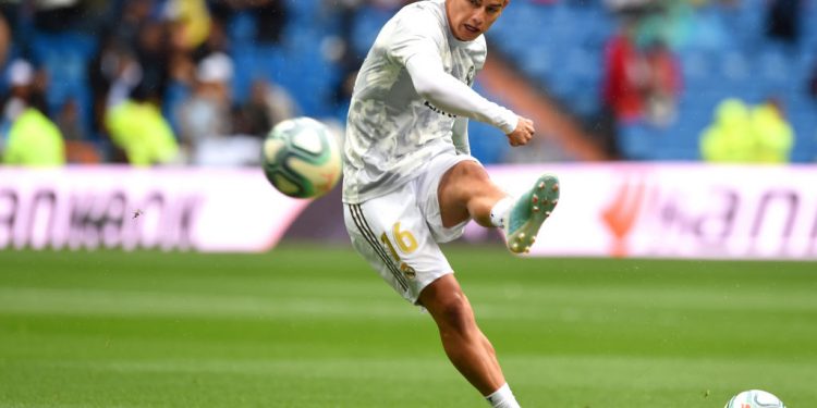 MADRID, SPAIN - SEPTEMBER 14: James Rodriguez of Real Madrid shoots as he warms up prior to the La Liga match between Real Madrid CF and Levante UD at Estadio Santiago Bernabeu on September 14, 2019 in Madrid, Spain. (Photo by Denis Doyle/Getty Images)