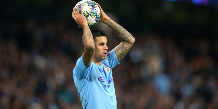 MANCHESTER, ENGLAND - OCTOBER 01:  Joao Cancelo of Manchester City takes a throw in during the UEFA Champions League group C match between Manchester City and Dinamo Zagreb at Etihad Stadium on October 01, 2019 in Manchester, United Kingdom. (Photo by Alex Livesey - Danehouse/Getty Images)