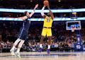 Nov 1, 2019; Dallas, TX, USA; Los Angeles Lakers forward LeBron James (23) shoots over Dallas Mavericks guard Luka Doncic (77) during the second half at American Airlines Center. Mandatory Credit: Kevin Jairaj-USA TODAY Sports