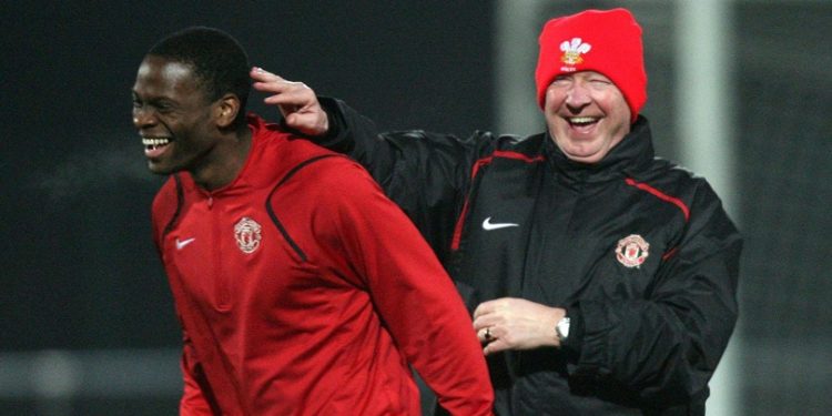 Manchester United's manager Alex Ferguson (right) jokes with Louis Saha during a training session at Lens training ground at La Gayette, Lens.