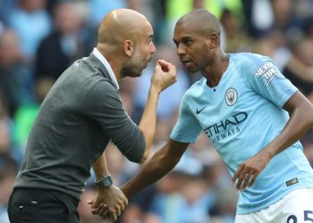 Manchester City's Spanish manager Pep Guardiola speaks with Manchester City's Brazilian midfielder Fernandinho during the English Premier League football match between Manchester City and Newcastle United at the Etihad Stadium in Manchester, north west England, on September 1, 2018. (Photo by Lindsey PARNABY / AFP) / RESTRICTED TO EDITORIAL USE. No use with unauthorized audio, video, data, fixture lists, club/league logos or 'live' services. Online in-match use limited to 120 images. An additional 40 images may be used in extra time. No video emulation. Social media in-match use limited to 120 images. An additional 40 images may be used in extra time. No use in betting publications, games or single club/league/player publications. /