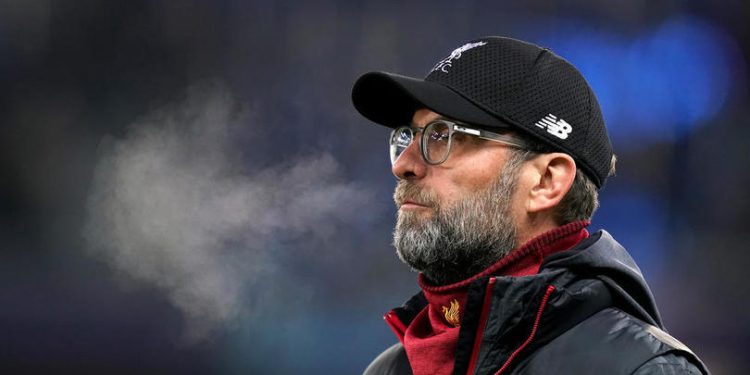 Liverpool manager Jurgen Klopp inspects the pitch before the UEFA Champions League match at the Red Bull Arena, Salzburg.