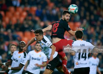 VALENCIA, SPAIN - FEBRUARY 14:   Gabriel Paulista (L) of Valencia competes for the ball with Felipe Augusto (C) of Atletico de Madrid during the Liga match between Valencia CF and Club Atletico de Madrid at Estadio Mestalla on February 14, 2020 in Valencia, Spain. (Photo by Pablo Morano/MB Media/Getty Images)