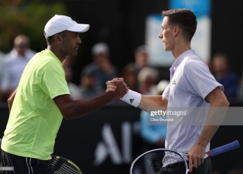 MELBOURNE, AUSTRALIA - JANUARY 23: Rajeev Ram of the United States and Joe Salisbury of Great Britain celebrate after winning a point during their Men's Doubles first round match against Daniel Evans of Great Britain (R) and John-Patrick Smith of Australia on day four of the 2020 Australian Open at Melbourne Park on January 23, 2020 in Melbourne, Australia. (Photo by Clive Brunskill/Getty Images)