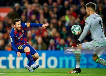 BARCELONA, SPAIN - MARCH 07: Lionel Messi of FC Barcelona competes for the ball with Alex Remiro of Real Sociedad during the Liga match between FC Barcelona and Real Sociedad at Camp Nou on March 07, 2020 in Barcelona, Spain.  (Photo by Silvestre Szpylma/Quality Sport Images/Getty Images)