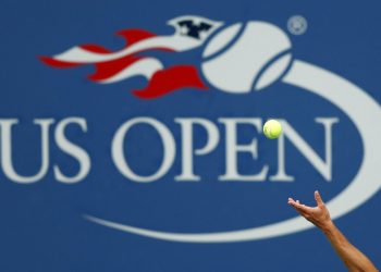 FILE - In this Sept. 2, 2017, file photo, Philipp Kohlschreiber, of Germany, serves to John Millman, of Australia, during the third round of the U.S. Open tennis tournament in New York. A high-ranking official for the U.S. Open tells the Associated Press that if the Grand Slam tennis tournament is held in 2020, she expects it to be at its usual site in New York and in its usual dates starting in August.  (AP Photo/Adam Hunger, File)