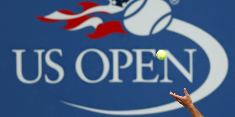 FILE - In this Sept. 2, 2017, file photo, Philipp Kohlschreiber, of Germany, serves to John Millman, of Australia, during the third round of the U.S. Open tennis tournament in New York. A high-ranking official for the U.S. Open tells the Associated Press that if the Grand Slam tennis tournament is held in 2020, she expects it to be at its usual site in New York and in its usual dates starting in August.  (AP Photo/Adam Hunger, File)