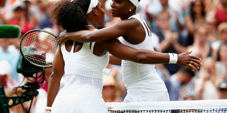 LONDON, ENGLAND - JULY 06:  Serena Williams of the United States hugs Venus Williams of the United States after their Ladies' Singles Fourth Round match  during day seven of the Wimbledon Lawn Tennis Championships at the All England Lawn Tennis and Croquet Club on July 6, 2015 in London, England.  (Photo by Julian Finney/Getty Images)