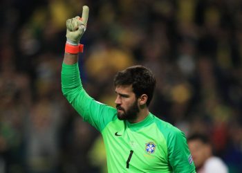 PORTO ALEGRE, BRAZIL - JUNE 27: Alisson Becker of Brazil celebrates after saving a penalty during the shootout after the Copa America Brazil 2019 quarterfinal match between Brazil and Paraguay at Arena do Gremio on June 27, 2019 in Porto Alegre, Brazil. (Photo by Buda Mendes/Getty Images)