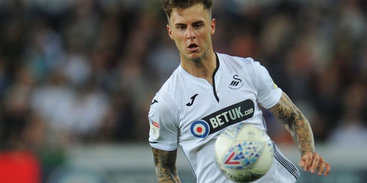 SWANSEA, WALES - AUGUST 21:  Swansea City's Joe Rodon during the Sky Bet Championship match between  City and Leeds United at Liberty Stadium on August 21, 2018 in Swansea, Wales. (Photo by Kevin Barnes - CameraSport via Getty Images)