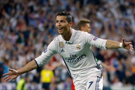 FILE - In this Tuesday, April 18, 2017 file photo, Real Madrid's Cristiano Ronaldo celebrates scoring during the Champions League quarterfinal second leg soccer match between Real Madrid and Bayern Munich at Santiago Bernabeu stadium in Madrid, Spain. The Champions League semifinals begin this week with Spanish rivals Real Madrid and Atletico Madrid meeting for the fourth consecutive time in the European competition, while surprising French club Monaco will try to keep Italian champion Juventus from returning to the final for the second time in three seasons. (AP Photo/Francisco Seco, File)
