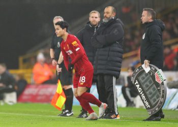 WOLVERHAMPTON, ENGLAND - JANUARY 23:  Takumi Minamino of Liverpool runs on to the pitch to make his premier league debut during the Premier League match between Wolverhampton Wanderers and Liverpool FC at Molineux on January 23, 2020 in Wolverhampton, United Kingdom. (Photo by Catherine Ivill/Getty Images)