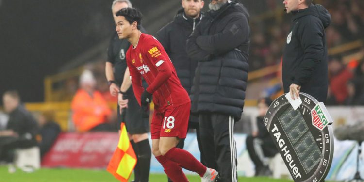 WOLVERHAMPTON, ENGLAND - JANUARY 23:  Takumi Minamino of Liverpool runs on to the pitch to make his premier league debut during the Premier League match between Wolverhampton Wanderers and Liverpool FC at Molineux on January 23, 2020 in Wolverhampton, United Kingdom. (Photo by Catherine Ivill/Getty Images)