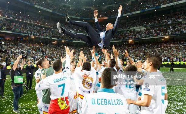 MADRID, SPAIN - MAY 27: Zinedine Zidane, Manager of Real Madrid is thrown in the air by his players during Real Madrid team celebration at Santiago Bernabeu Stadium after winning their 13th European Cup on May 27, 2018 in Madrid, Spain.(Photo by Helios de la Rubia/Real Madrid via Getty Images)