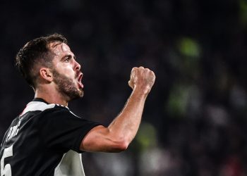 Juventus' Bosnian midfielder Miralem Pjanic celebrates after scoring during the Italian Serie A football match Juventus vs Bologna on October 19, 2019 at the Juventus stadium in Turin. (Photo by Marco Bertorello / AFP) (Photo by MARCO BERTORELLO/AFP via Getty Images)