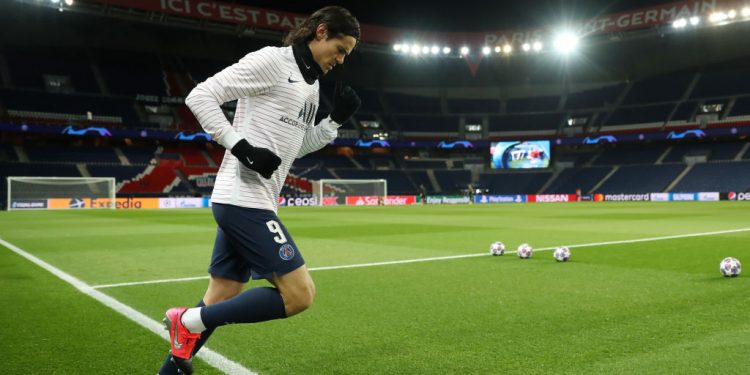 PARIS, FRANCE - MARCH 11: (FREE FOR EDITORIAL USE) In this handout image provided by UEFA, Edinson Cavani of Paris Saint-Germain runs out to warm up prior to the UEFA Champions League round of 16 second leg match between Paris Saint-Germain and Borussia Dortmund at Parc des Princes on March 11, 2020 in Paris, France. The match is played behind closed doors as a precaution against the spread of COVID-19 (Coronavirus).  (Photo by UEFA - Handout/UEFA via Getty Images)
