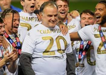 LEEDS, ENGLAND - JULY 22: The players of Leeds celebrate their manager Marcelo Bielsa with the trophy during the Sky Bet Championship match between Leeds United and Charlton Athletic at Elland Road on July 22, 2020 in Leeds, England. Football Stadiums around Europe remain empty due to the Coronavirus Pandemic as Government social distancing laws prohibit fans inside venues resulting in all fixtures being played behind closed doors. (Photo by Michael Regan/Getty Images)