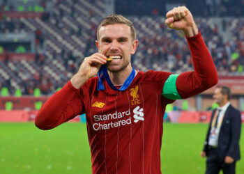 DOHA, QATAR - Saturday, December 21, 2019: Liverpool's captain Jordan Henderson bites his winners' medal after the FIFA Club World Cup Qatar 2019 Final match between CR Flamengo and Liverpool FC at the Khalifa Stadium. Liverpool won 1-0 after extra time. (Pic by David Rawcliffe/Propaganda)