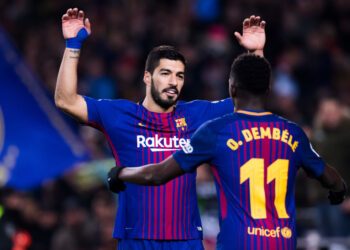 BARCELONA, SPAIN - FEBRUARY 24:  Luis Suarez of FC Barcelona celebrates with his teammate Ousmane Dembele after scoring his team's sixth goal during the La Liga match between Barcelona and Girona at Camp Nou on February 24, 2018 in Barcelona, Spain.  (Photo by Alex Caparros/Getty Images)