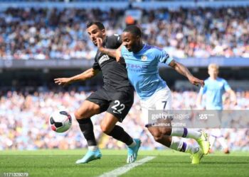 MANCHESTER, ENGLAND - AUGUST 31: Martin Montoya of Brighton and Hove Albion battles for possession with Raheem Sterling of Manchester City during the Premier League match between Manchester City and Brighton & Hove Albion at Etihad Stadium on August 31, 2019 in Manchester, United Kingdom. (Photo by Laurence Griffiths/Getty Images)