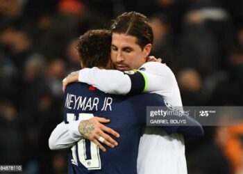 (FromL) Paris Saint-Germain's Brazilian forward Neymar and Real Madrid's Spanish defender Sergio Ramos great each other at the end of the UEFA Champions League group A football match Real Madrid against Paris Saint-Germain FC at the Santiago Bernabeu stadium in Madrid on November 26, 2019. (Photo by GABRIEL BOUYS / AFP) (Photo by GABRIEL BOUYS/AFP via Getty Images)