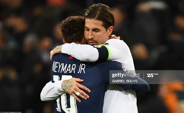 (FromL) Paris Saint-Germain's Brazilian forward Neymar and Real Madrid's Spanish defender Sergio Ramos great each other at the end of the UEFA Champions League group A football match Real Madrid against Paris Saint-Germain FC at the Santiago Bernabeu stadium in Madrid on November 26, 2019. (Photo by GABRIEL BOUYS / AFP) (Photo by GABRIEL BOUYS/AFP via Getty Images)