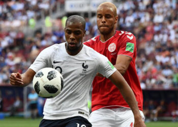 France's defender Djibril Sidibe (L) vies with Denmark's defender Mathias Jorgensen during the Russia 2018 World Cup Group C football match between Denmark and France at the Luzhniki Stadium in Moscow on June 26, 2018. / AFP PHOTO / Jewel SAMAD / RESTRICTED TO EDITORIAL USE - NO MOBILE PUSH ALERTS/DOWNLOADS