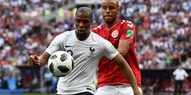 France's defender Djibril Sidibe (L) vies with Denmark's defender Mathias Jorgensen during the Russia 2018 World Cup Group C football match between Denmark and France at the Luzhniki Stadium in Moscow on June 26, 2018. / AFP PHOTO / Jewel SAMAD / RESTRICTED TO EDITORIAL USE - NO MOBILE PUSH ALERTS/DOWNLOADS