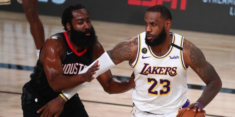 Sep 12, 2020; Lake Buena Vista, Florida, USA; Los Angeles Lakers forward LeBron James (23) dribbles the ball around Houston Rockets guard James Harden (13) in the first half of game five of the second round of the 2020 NBA Playoffs at ESPN Wide World of Sports Complex. Mandatory Credit: Kim Klement-USA TODAY Sports