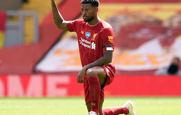 Liverpool's Dutch midfielder Georginio Wijnaldum takes a knee during the English Premier League football match between Liverpool and Burnley at Anfield in Liverpool, north west England on July 11, 2020. - Phil Noble (Photo by Oli SCARFF / POOL / AFP) / RESTRICTED TO EDITORIAL USE. No use with unauthorized audio, video, data, fixture lists, club/league logos or 'live' services. Online in-match use limited to 120 images. An additional 40 images may be used in extra time. No video emulation. Social media in-match use limited to 120 images. An additional 40 images may be used in extra time. No use in betting publications, games or single club/league/player publications. /  (Photo by OLI SCARFF/POOL/AFP via Getty Images)