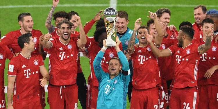 Soccer Football - DFL-Supercup - Bayern Munich v Borussia Dortmund - Allianz Arena, Munich, Germany - September 30, 2020  Bayern Munich's Manuel Neuer and teammates celebrate with the trophy after winning the Supercup   REUTERS/Andreas Gebert/Pool  DFL regulations prohibit any use of photographs as image sequences and/or quasi-video