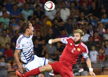 Gael Andonian (R) fights for the ball in the air with Yussuf Poulsen during the UEFA Euro 2016 Group I qualifying round match between Armenia and Denmark at Vazgen Sargsyan stadium in Yerevan, Armenia on September 07