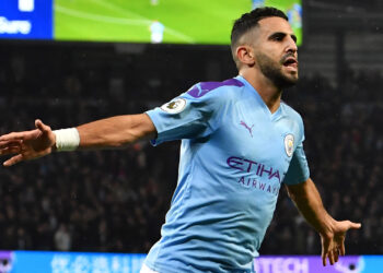 Manchester City's Algerian midfielder Riyad Mahrez celebrates after scoring their second goal during the English Premier League football match between Manchester City and Chelsea at the Etihad Stadium in Manchester, north west England, on November 23, 2019. (Photo by Paul ELLIS / AFP) / RESTRICTED TO EDITORIAL USE. No use with unauthorized audio, video, data, fixture lists, club/league logos or 'live' services. Online in-match use limited to 120 images. An additional 40 images may be used in extra time. No video emulation. Social media in-match use limited to 120 images. An additional 40 images may be used in extra time. No use in betting publications, games or single club/league/player publications. /  (Photo by PAUL ELLIS/AFP via Getty Images)