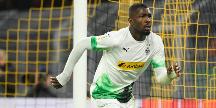 Moenchengladbach's French forward Marcus Thuram celebrates scoring the opening goal during the German Cup (DFB Pokal) second round football match BVB Borussia Dortmund v Borussia Moenchenglanbach in Dortmund, western Germany on October 30, 2019. (Photo by INA FASSBENDER / AFP) / DFB REGULATIONS PROHIBIT ANY USE OF PHOTOGRAPHS AS IMAGE SEQUENCES AND QUASI-VIDEO. (Photo by INA FASSBENDER/AFP via Getty Images)